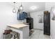 Basement kitchenette with bar and dark cabinets at 637 W 174Th Ave, Broomfield, CO 80023