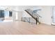 Bright living area with hardwood floors and modern staircase at 1283 Meade St, Denver, CO 80204