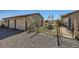 Backyard with detached garage, patio furniture, and fenced area at 2452 Shetland Trl, Elizabeth, CO 80107