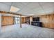 Finished basement with wood paneling and a view at 2452 Shetland Trl, Elizabeth, CO 80107