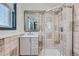 Clean bathroom with updated vanity and a tiled shower at 2452 Shetland Trl, Elizabeth, CO 80107