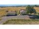 Aerial view of house, detached garage, and ample land at 2452 Shetland Trl, Elizabeth, CO 80107