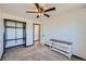 Well-lit bedroom with a ceiling fan and ample closet space at 2452 Shetland Trl, Elizabeth, CO 80107