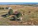Aerial view of property showing house and outbuildings at 2452 Shetland Trl, Elizabeth, CO 80107