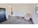 Cozy living room with comfortable armchair and natural light at 2452 Shetland Trl, Elizabeth, CO 80107