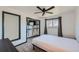 Bright bedroom with built-in shelving and window views at 2452 Shetland Trl, Elizabeth, CO 80107