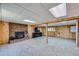 Finished basement featuring a brick fireplace and wood paneling at 2452 Shetland Trl, Elizabeth, CO 80107