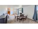 Cozy dining area with a wood table and carpeted flooring at 2452 Shetland Trl, Elizabeth, CO 80107