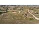 Aerial view of property showing house, outbuildings, and expansive land at 2452 Shetland Trl, Elizabeth, CO 80107