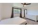 Bright bedroom featuring a ceiling fan and a large window at 2452 Shetland Trl, Elizabeth, CO 80107
