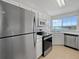 Modern kitchen with stainless steel appliances and lake view at 6850 Xavier Cir # 12, Westminster, CO 80030