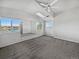 Main bedroom with vaulted ceiling, lake view, and ceiling fan at 6850 Xavier Cir # 12, Westminster, CO 80030