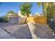 Detachable garage with a new wood fence and a spacious yard at 2103 S Lafayette St, Denver, CO 80210