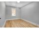 Charming bedroom with hardwood floors and large window at 2103 S Lafayette St, Denver, CO 80210