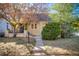 Charming bungalow home with a landscaped yard and front porch at 2103 S Lafayette St, Denver, CO 80210