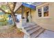 Inviting front porch with steps leading to the home's entrance at 2103 S Lafayette St, Denver, CO 80210