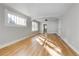 Bright living room featuring hardwood floors and abundant natural light at 2103 S Lafayette St, Denver, CO 80210