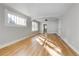 Bright and spacious living room with hardwood floors and large windows at 2103 S Lafayette St, Denver, CO 80210