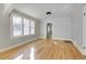 Hardwood floors and an open concept living area with view to kitchen at 2103 S Lafayette St, Denver, CO 80210