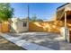 Large backyard with a new wood fence and gravel area at 2103 S Lafayette St, Denver, CO 80210