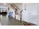 Bright and spacious entryway with staircase, tile flooring and coat rack at 941 Saint Andrews Ln, Louisville, CO 80027