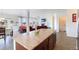 Open concept kitchen with an island, granite countertops and view of living room at 941 Saint Andrews Ln, Louisville, CO 80027
