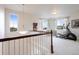 Spacious loft area with exercise equipment and multiple windows at 941 Saint Andrews Ln, Louisville, CO 80027