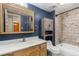 Clean bathroom, navy blue walls, wood vanity at 1021 Carr St # 22, Lakewood, CO 80214