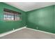 Simple bedroom with green walls and carpet at 1021 Carr St # 22, Lakewood, CO 80214
