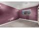 Purple bedroom with window and closet at 1021 Carr St # 22, Lakewood, CO 80214