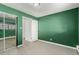 Green bedroom with mirrored closet at 1021 Carr St # 22, Lakewood, CO 80214