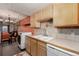 Kitchen with light wood cabinets and appliances at 1021 Carr St # 22, Lakewood, CO 80214