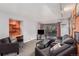 Living room with grey sectional sofa and balcony access at 1021 Carr St # 22, Lakewood, CO 80214