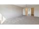 Spacious carpeted bedroom with ensuite bathroom access at 3460 S Poplar St # 307, Denver, CO 80224