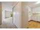 Hallway view of living room and kitchen at 3460 S Poplar St # 307, Denver, CO 80224