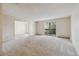 Spacious condo living room with access to a balcony at 3460 S Poplar St # 307, Denver, CO 80224