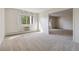 Spacious living room with carpet flooring and large window at 3460 S Poplar St # 307, Denver, CO 80224