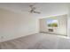 Bedroom with carpet flooring, window, and AC unit at 3460 S Poplar St # 307, Denver, CO 80224
