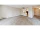 Condo living room with carpet flooring and an open kitchen at 3460 S Poplar St # 307, Denver, CO 80224