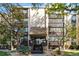 Condo building exterior with landscaping and steps leading to the entrance at 3460 S Poplar St # 307, Denver, CO 80224