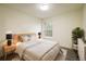 Main bedroom with wood bed frame and stylish nightstands at 7881 Allison Way # 301, Arvada, CO 80005