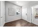 Bright and spacious entryway with hardwood floors and modern light fixtures at 6537 N Cathay St, Denver, CO 80249