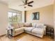 Light and airy living room with an L-shaped sofa and large windows at 453 S Quay St, Lakewood, CO 80226