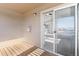 Wooden balcony with sliding glass door to carpeted living space at 12768 Ironstone Way # 301, Parker, CO 80134