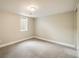 Bright finished basement bedroom featuring a window and neutral decor at 357 Kenton St, Aurora, CO 80010