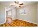 Hardwood floors, ceiling fan, and view of another room at 357 Kenton St, Aurora, CO 80010