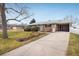 Ranch home with carport and nicely landscaped yard at 357 Kenton St, Aurora, CO 80010