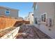 Landscaped backyard with stone path and wooden border at 20000 Mitchell Pl # 71, Denver, CO 80249