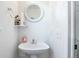 Small bathroom with a sink, toilet, and mirror at 20000 Mitchell Pl # 71, Denver, CO 80249