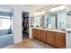 Bathroom with double vanity and walk-in closet at 20000 Mitchell Pl # 71, Denver, CO 80249